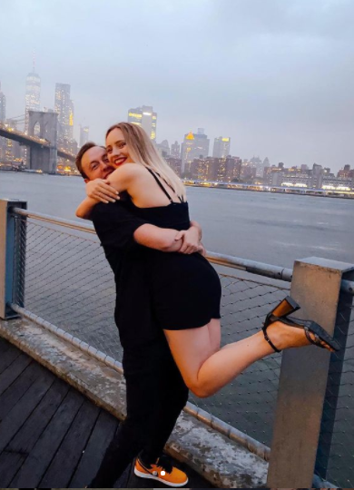 Andrew Rayel and Daniela Prisacaru embrace with a breath-taking view of New York. 